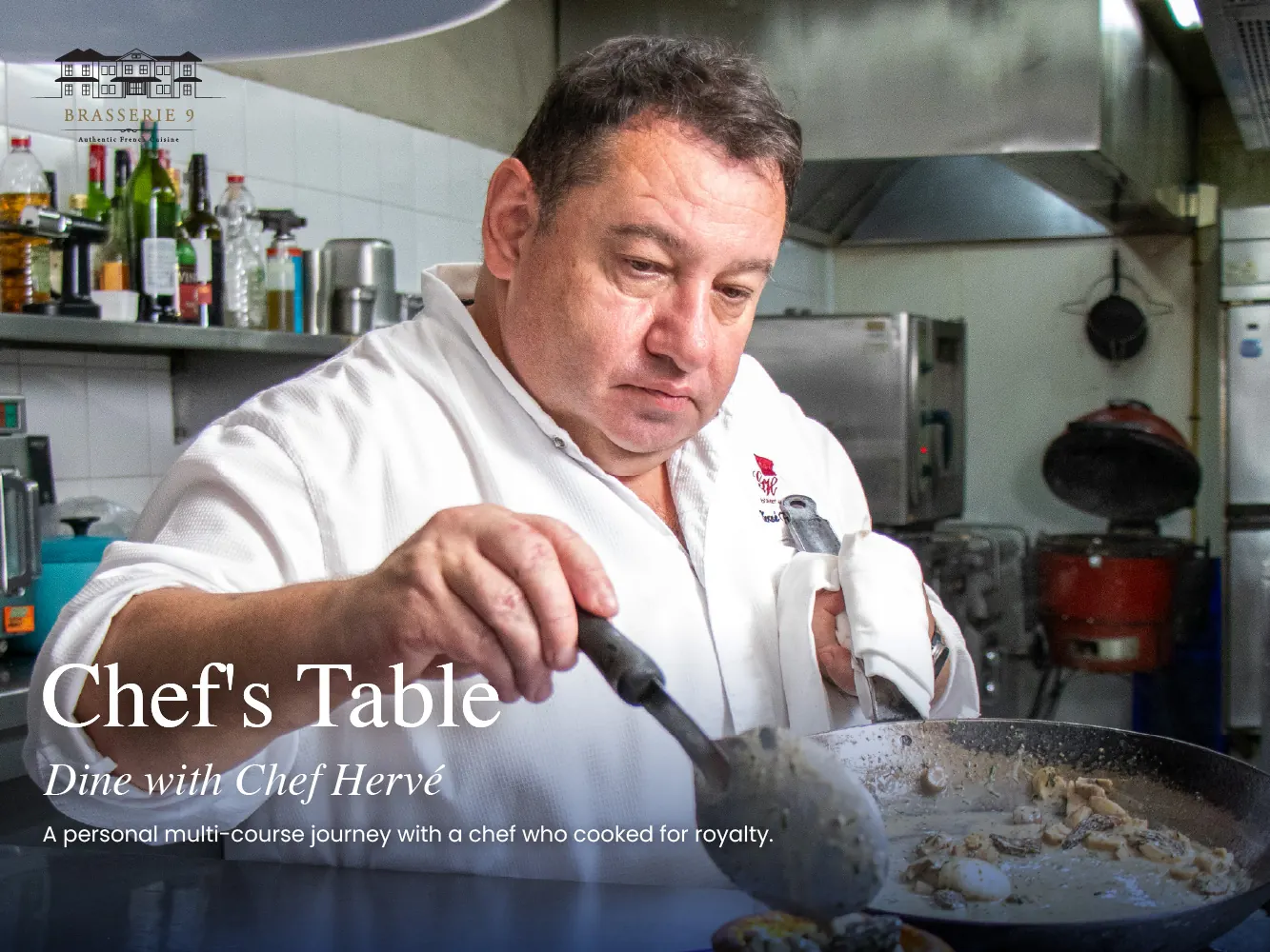 Chef Hervé Frérard cooking at the stove in the Brasserie 9 kitchen in Sathorn, Bangkok